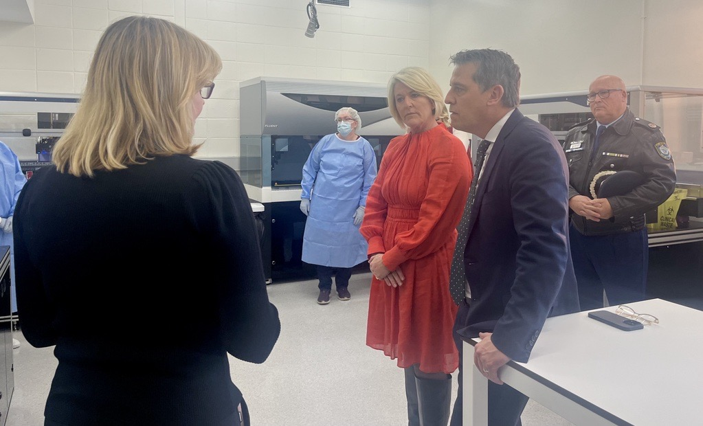 People talking in a high-tech laboratory.