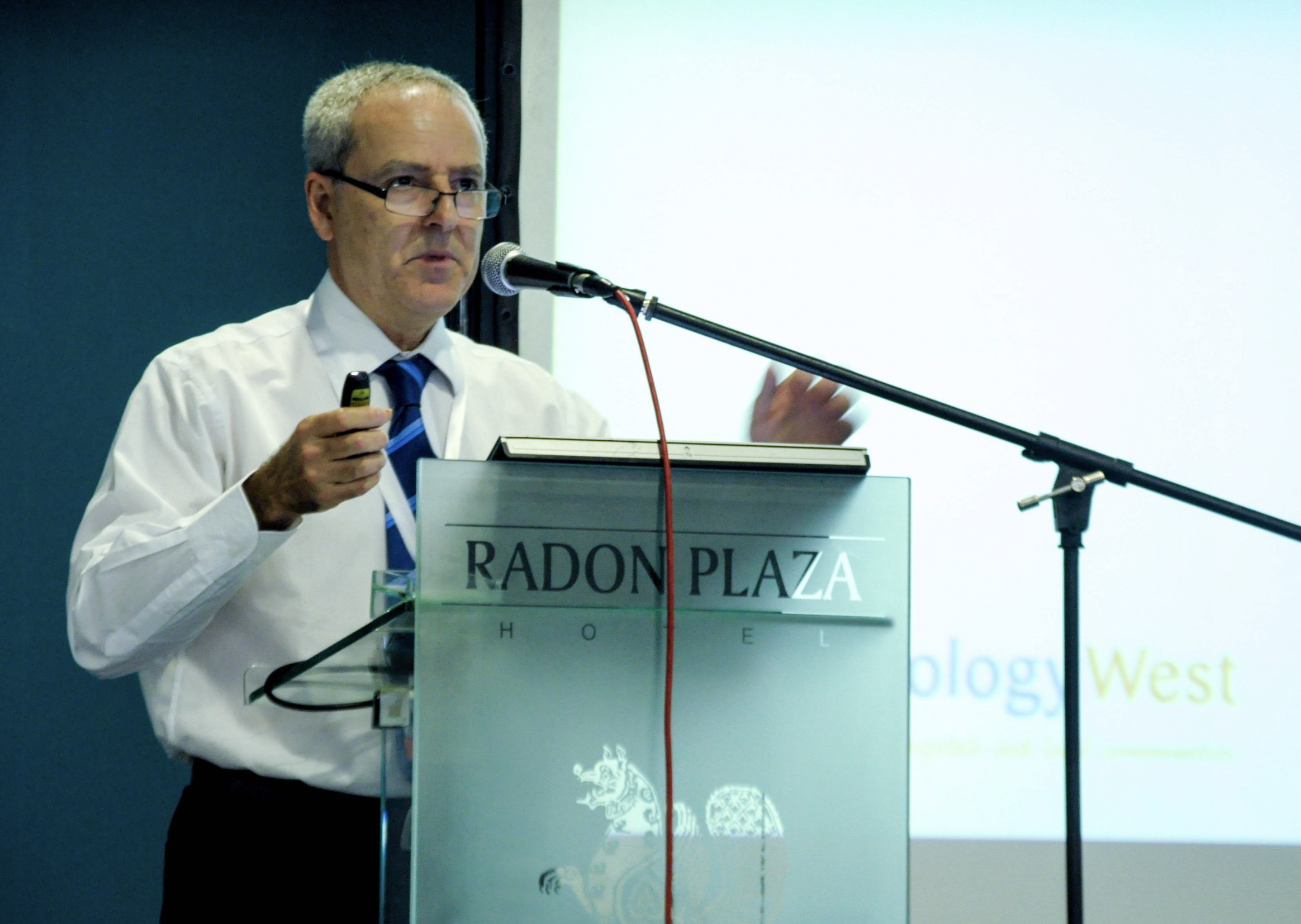 A man standing at a podium giving a speech.