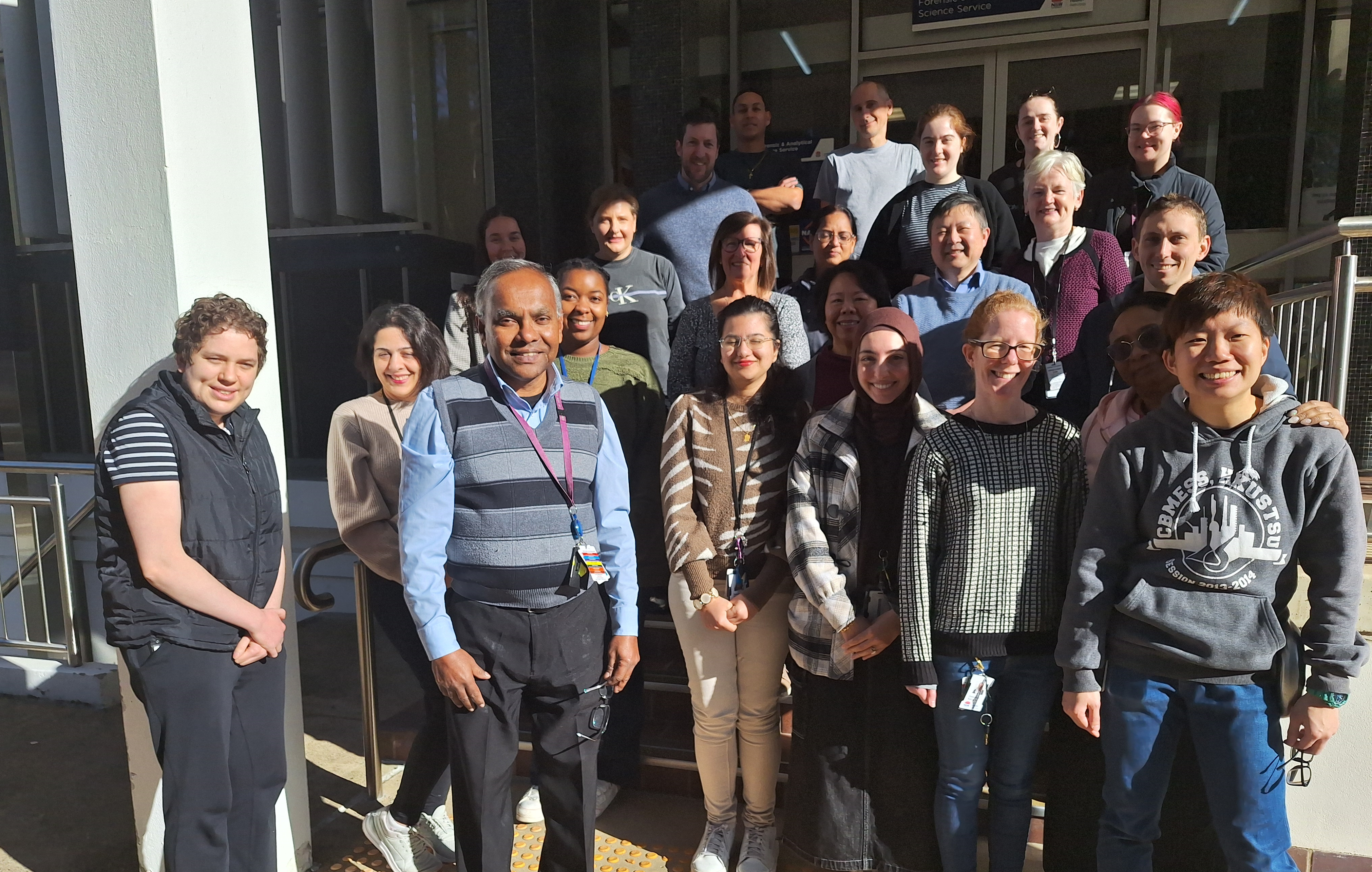 FASS family farewells long-serving scientific officer 1 A group of people standing on steps outside a building.