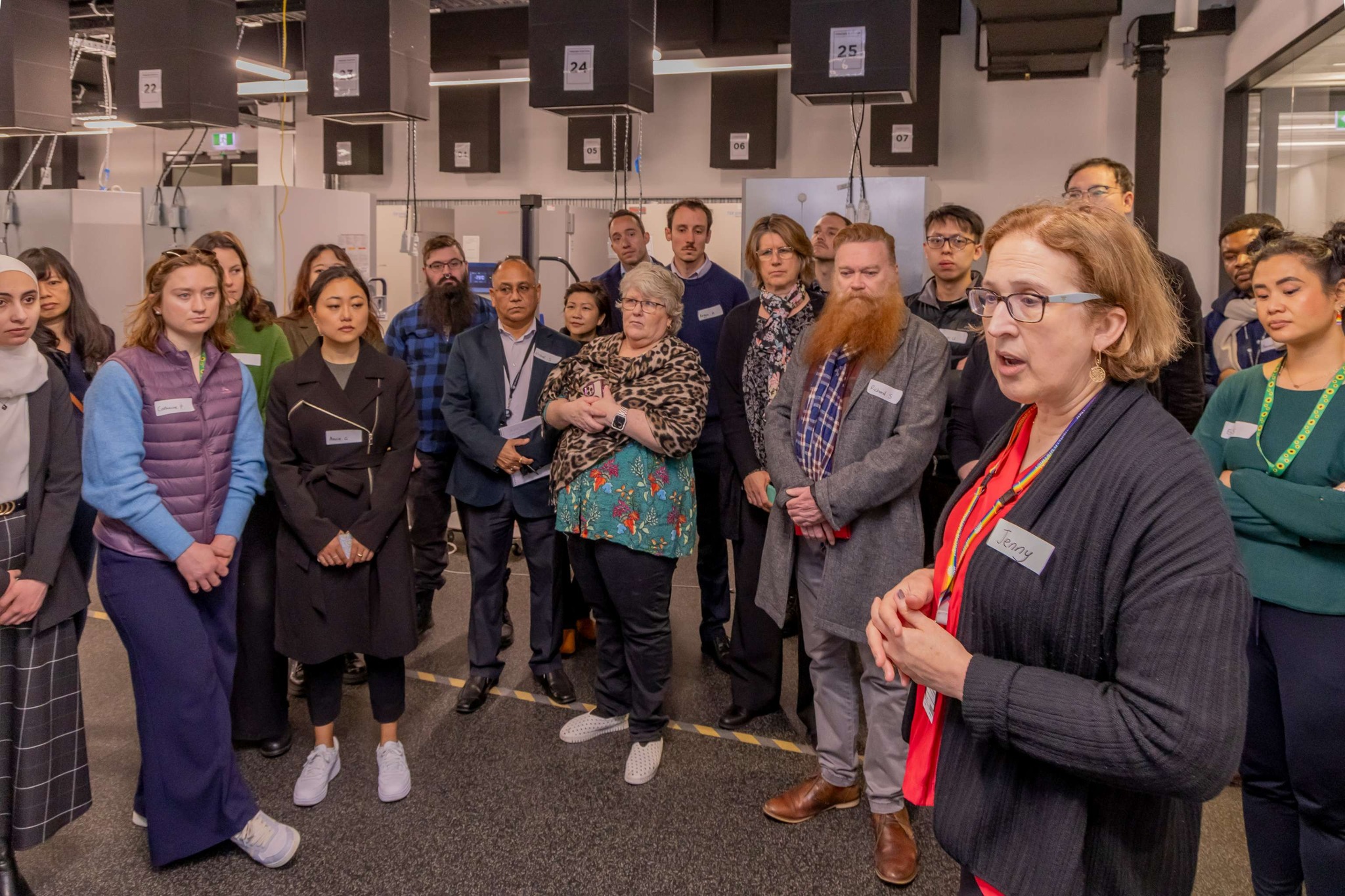 Take a look inside the NSW Health Statewide Biobank 1 A woman speaking in front of a large group of people wearing visitor name tags.