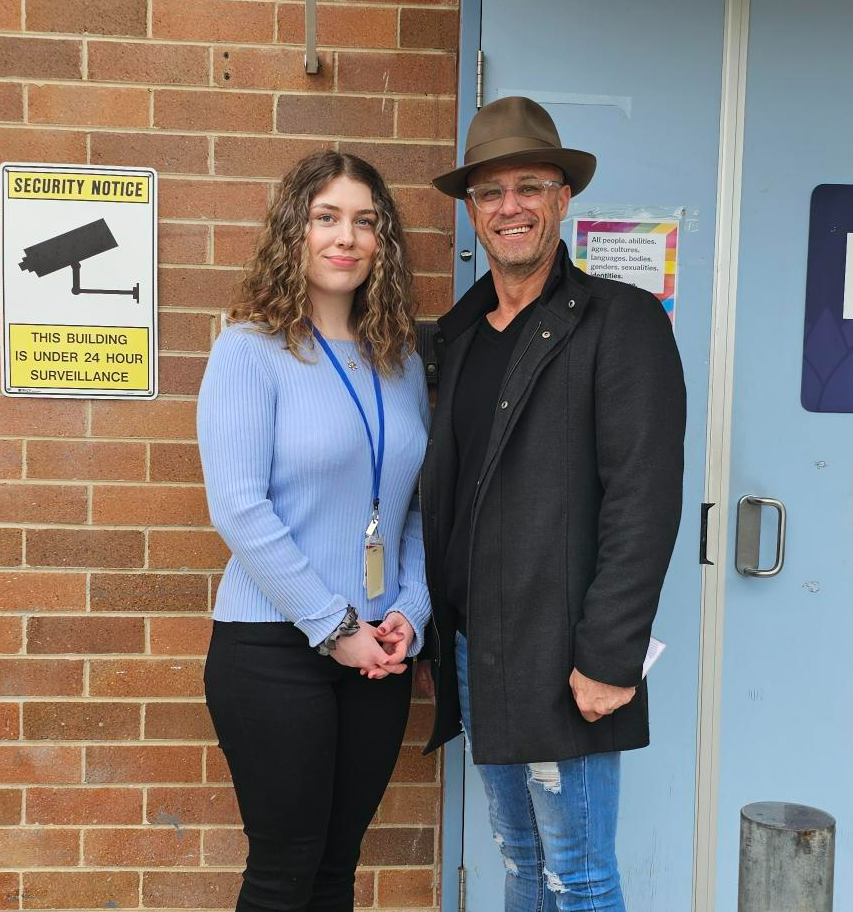 Fulfilling a childhood dream to work in forensics 1 A woman and a man standing outside a building.