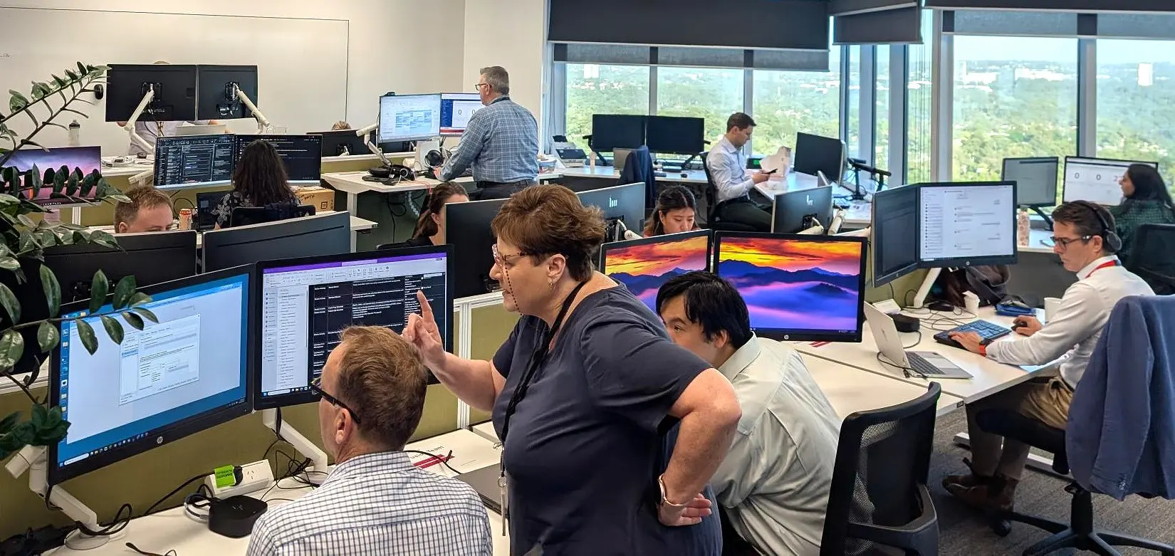 A room of people looking at computer screens.