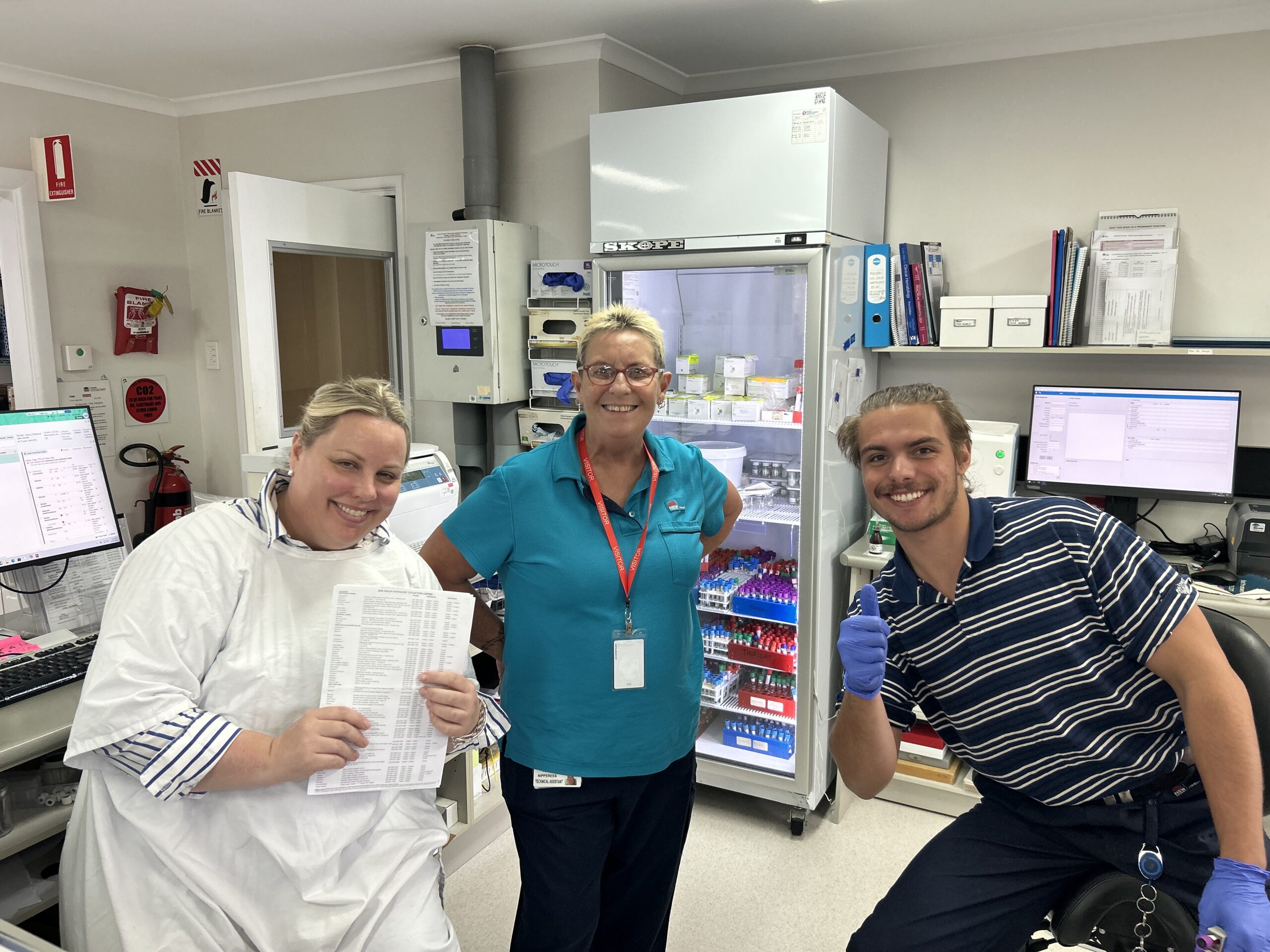 A group of smiling laboratory staff.