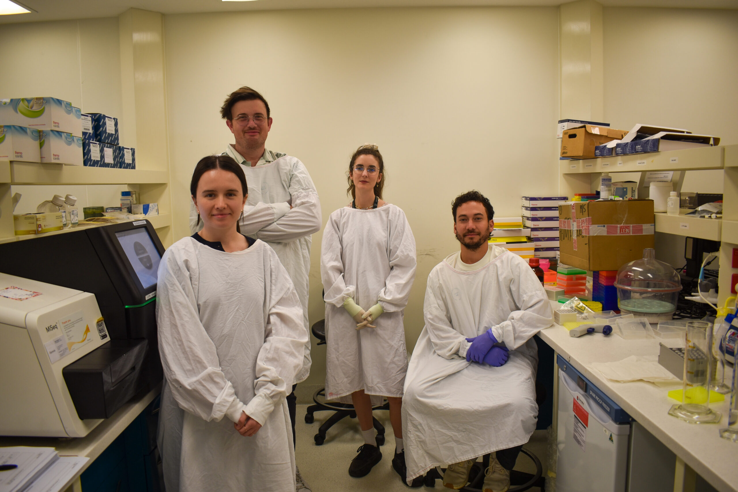 Best publication award for COVID-19 research 1 A group of people in a laboratory wearing white lab coats.